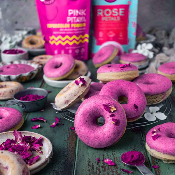 http://suncorefoods.com/cdn/shop/products/SUNCORE-FOODS_ROSE-DONUTS-WITH-PINK-PITAYA-GLAZE_grande.jpg?v=1692483093